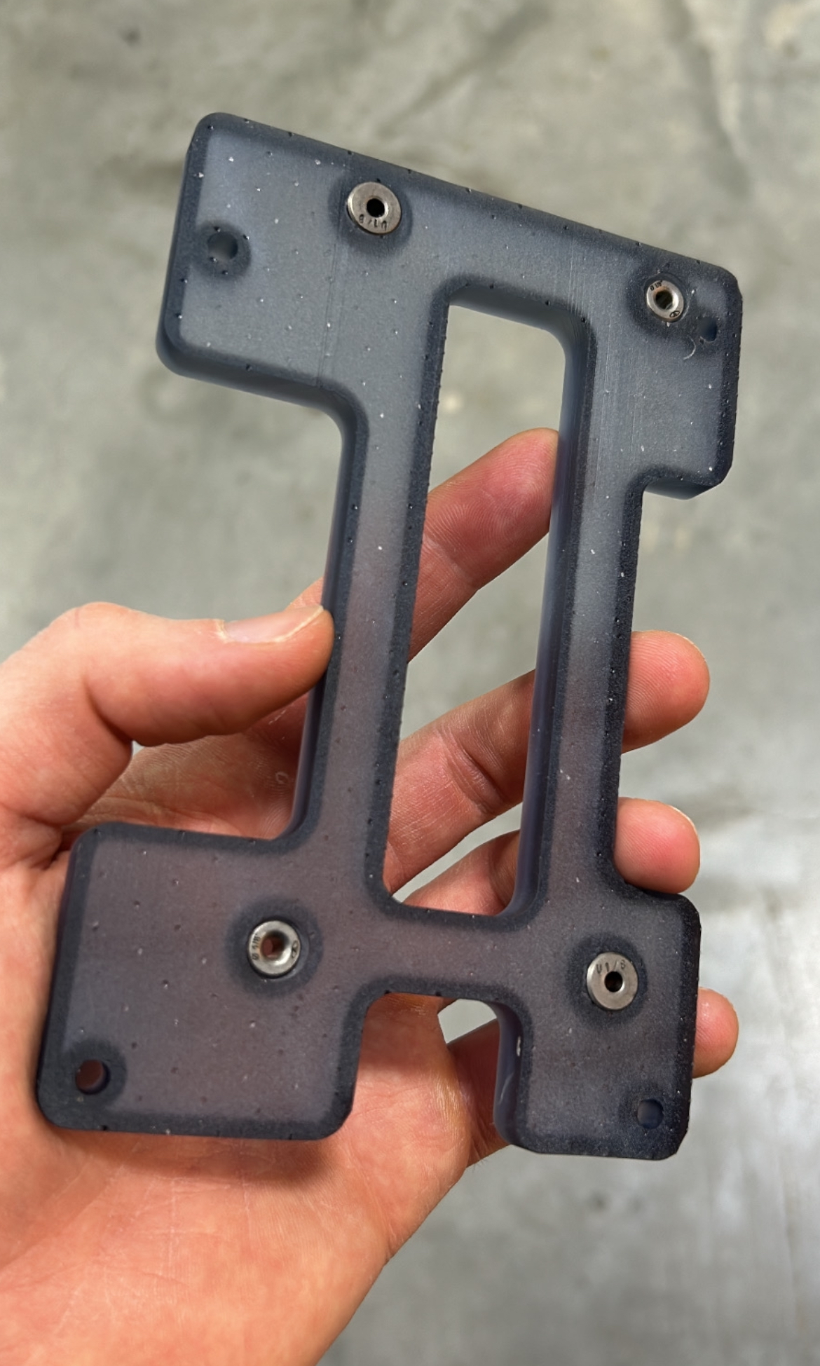 3D printed hole jig with a detailed view of the printed structure